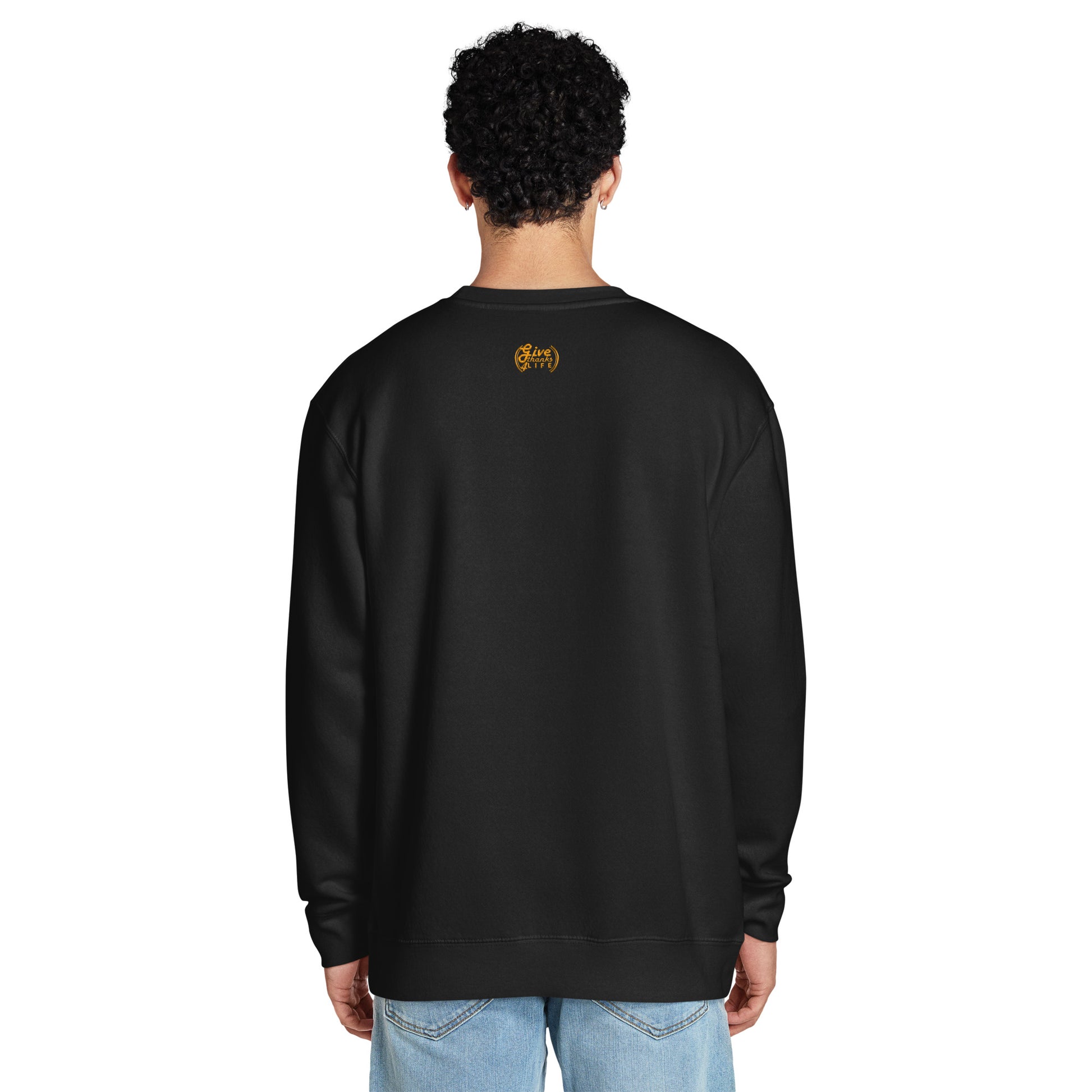 Person wearing a black sweatshirt with a logo on the back against a white background