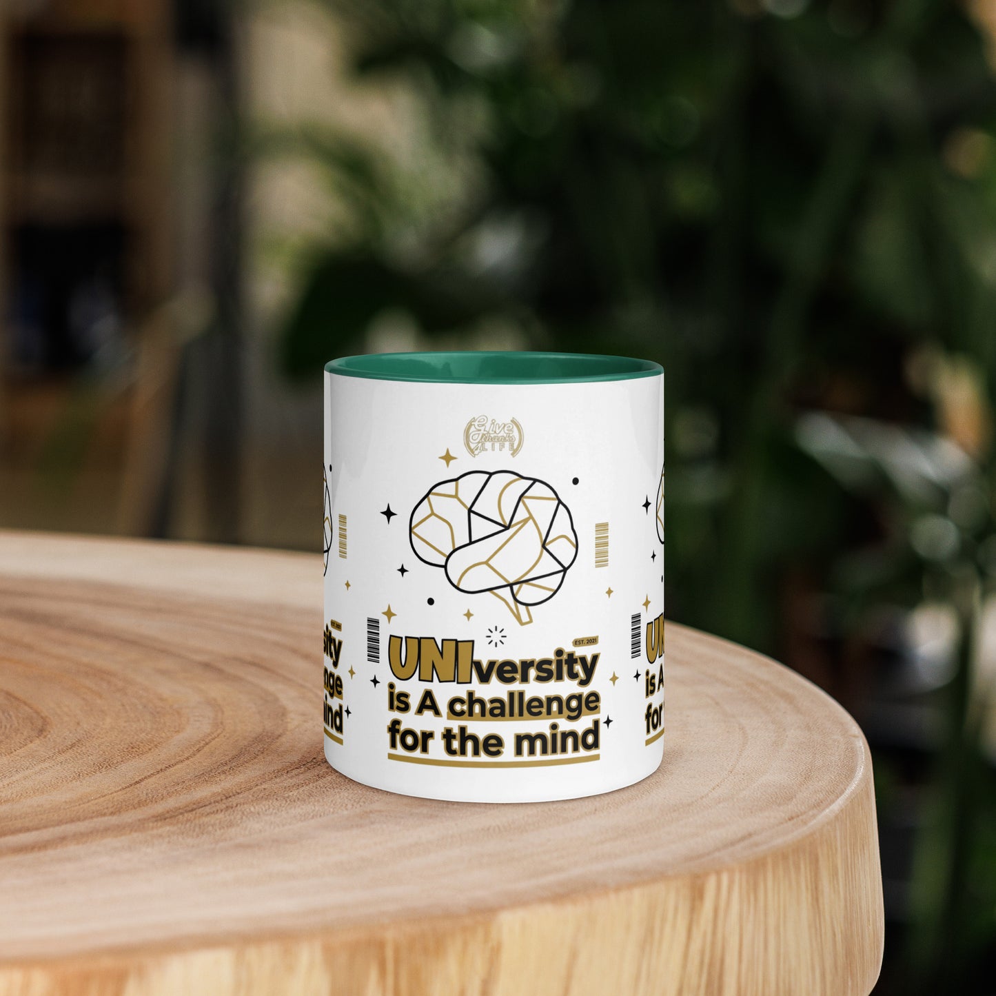 Mug with educational design on a wooden surface with a blurred background