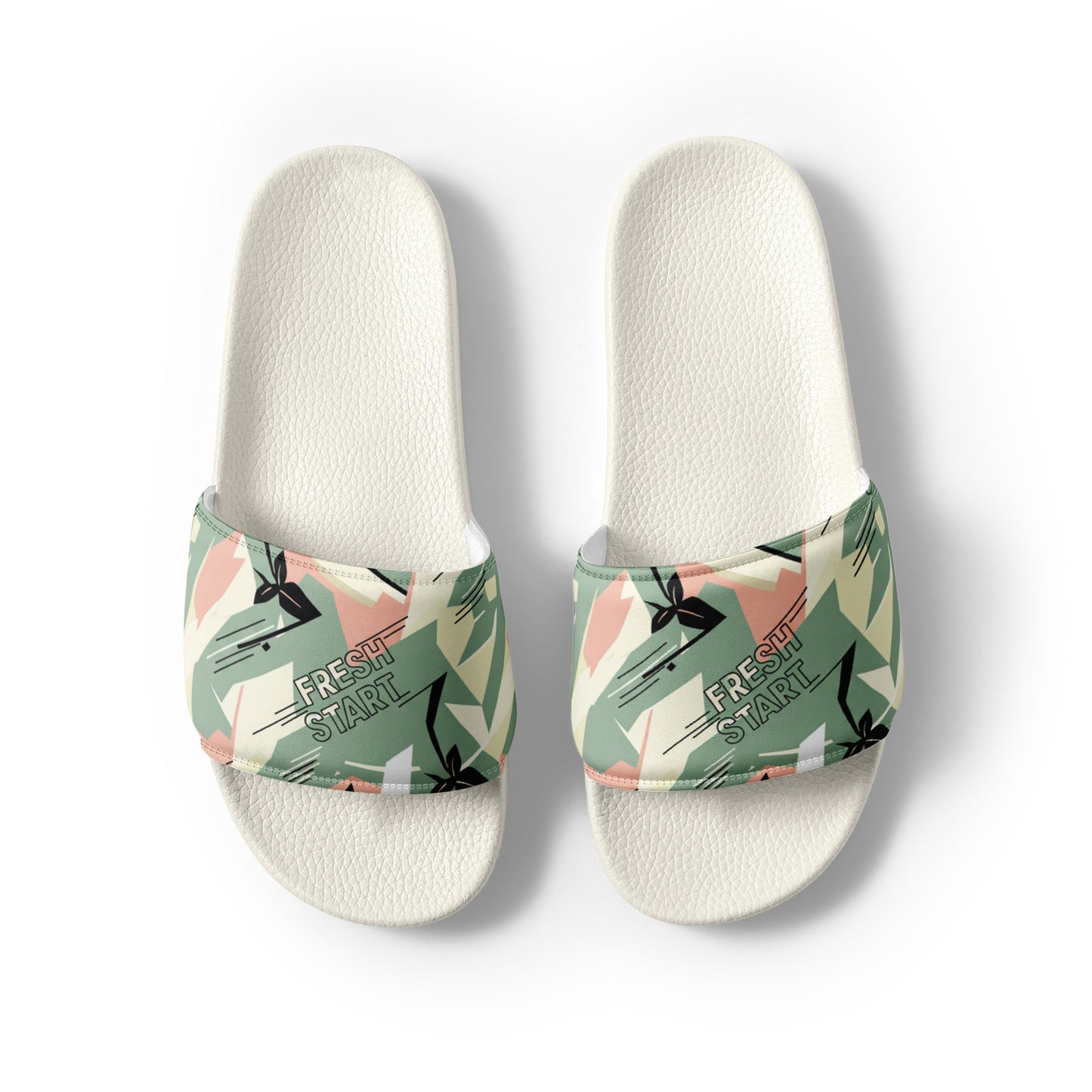 Pair of slides with floral strap design on a white background