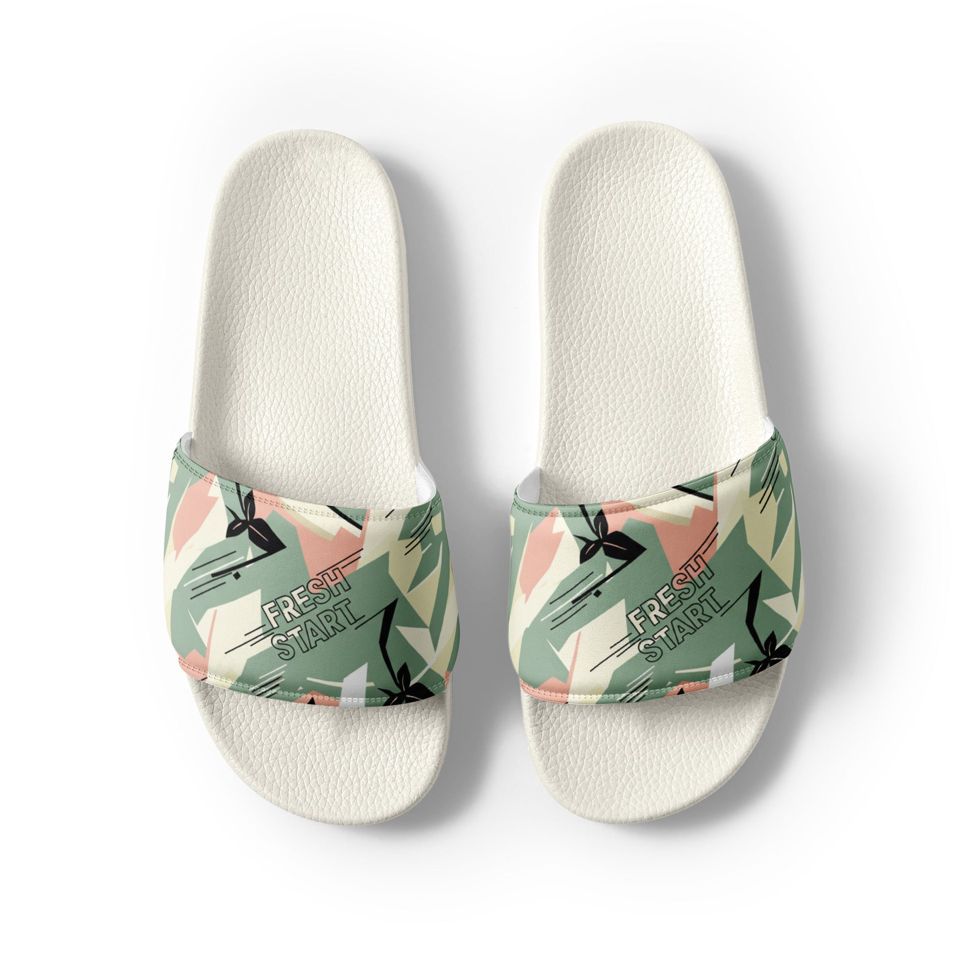 Pair of slides with floral strap design on a white background