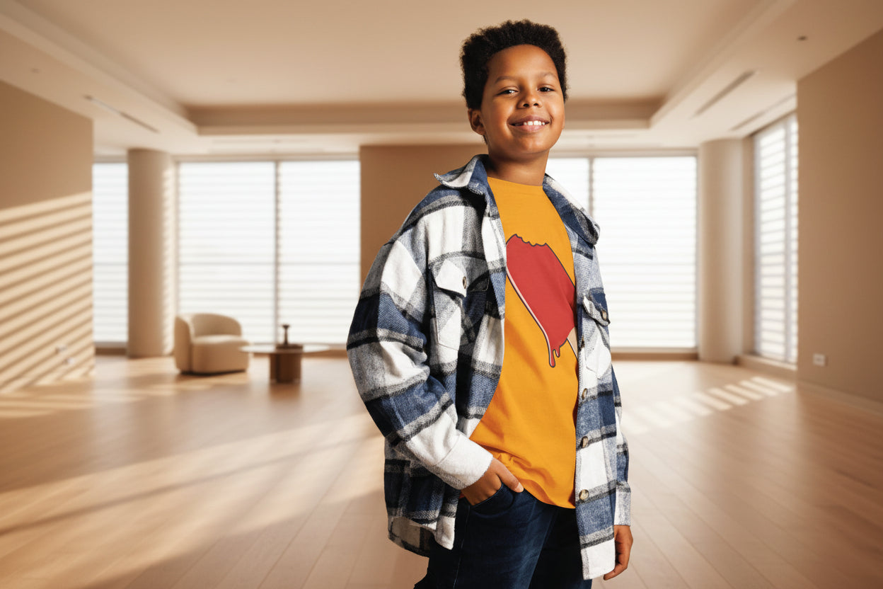 Child wearing a plaid shirt over a graphic t-shirt against a striped background