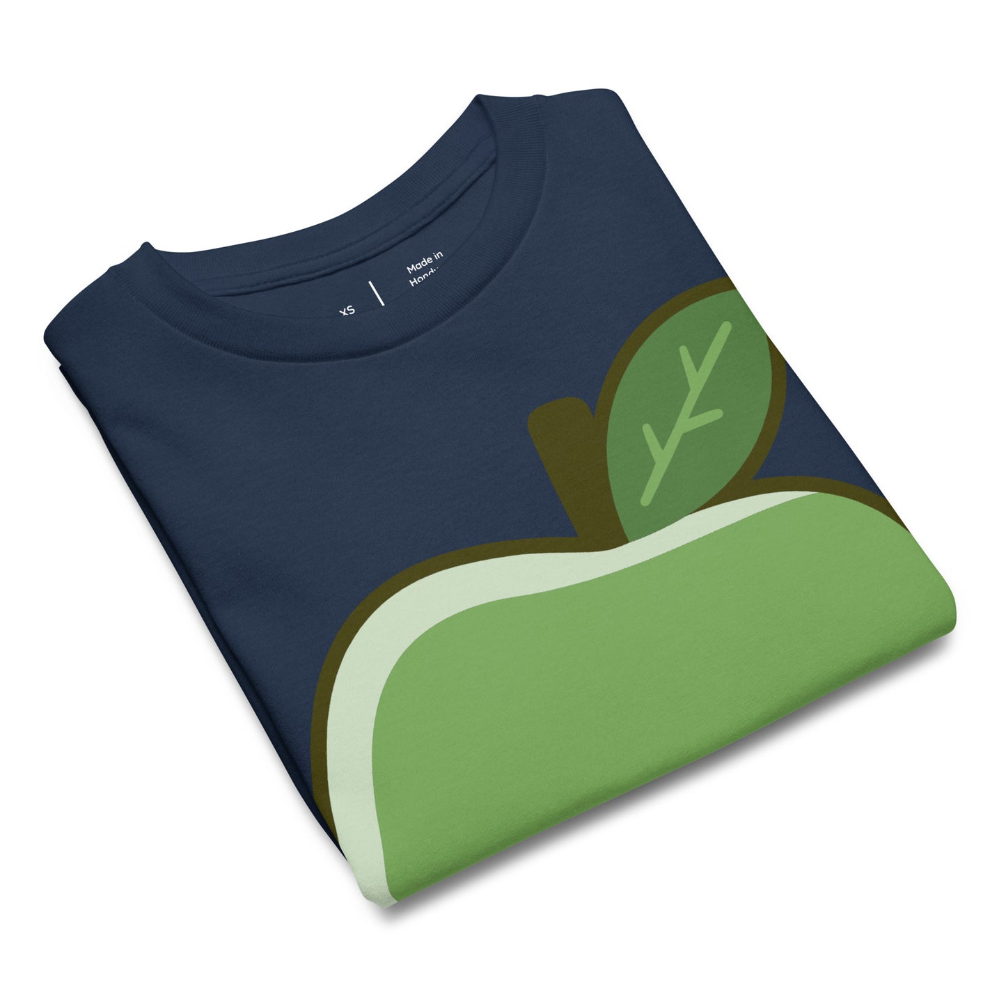 Folded navy blue t-shirt with a green apple design on a white background