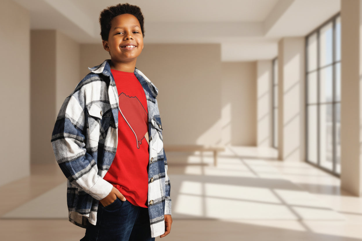 Child wearing a red shirt with a graphic design and a plaid jacket against a striped background