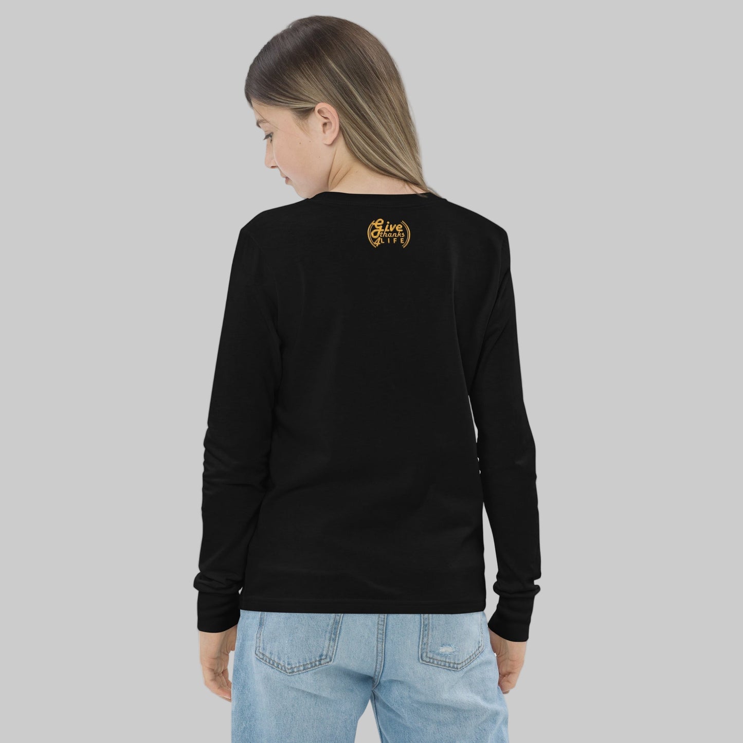 Person wearing a black long-sleeve shirt with a logo on the back, standing against a white background