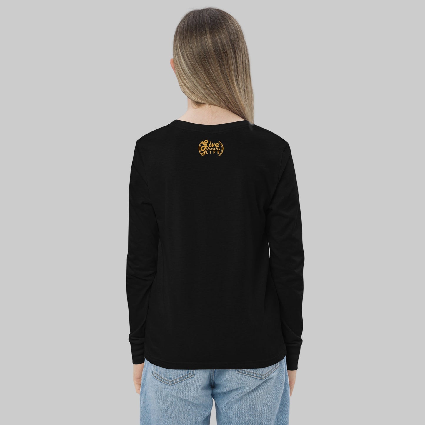 Person wearing a black long-sleeve shirt with a logo on the back, standing against a white background