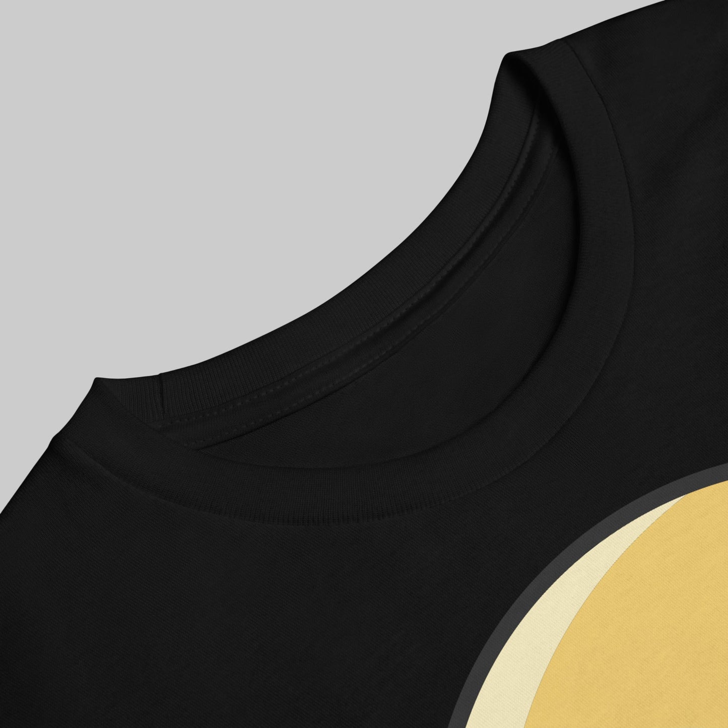 Black sleeveless top with a gold circular design on a white background