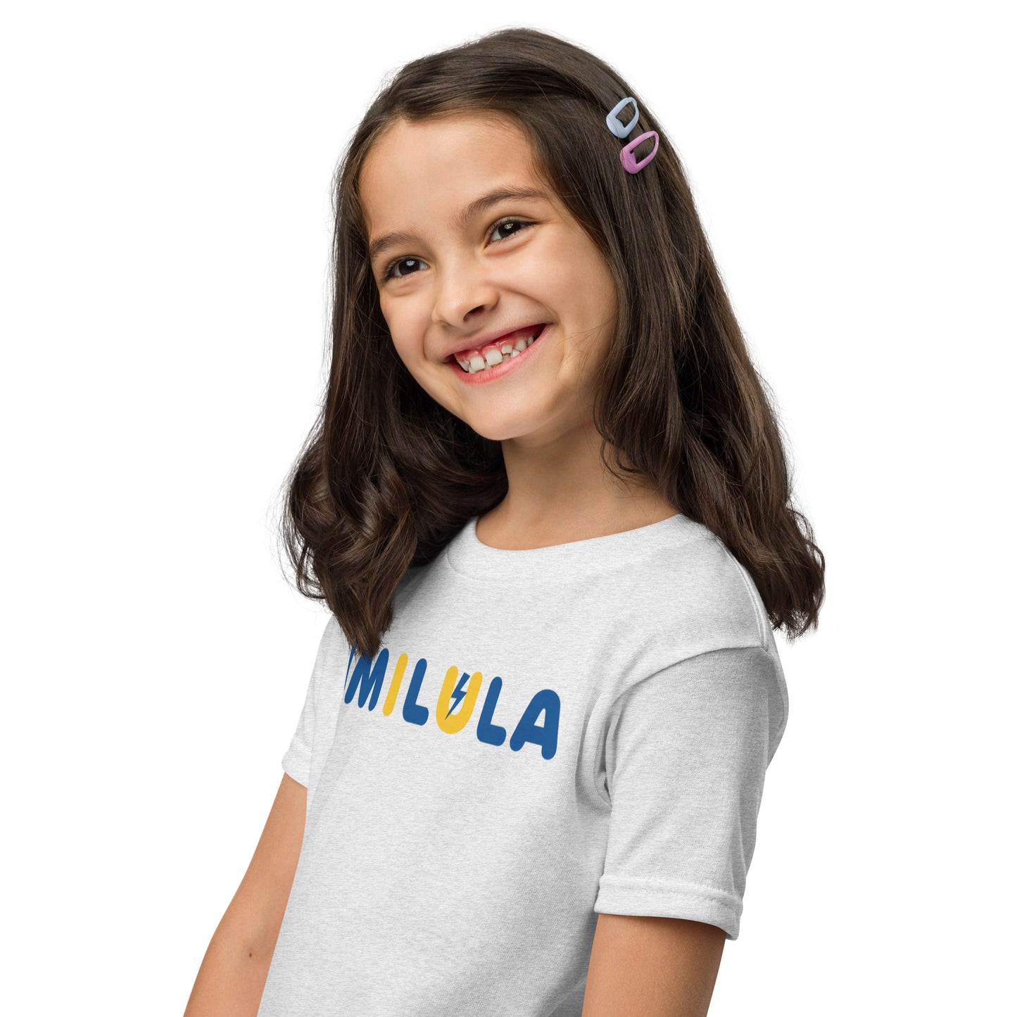 Young girl wearing a white t-shirt with 'MILULA' printed on it against a white background
