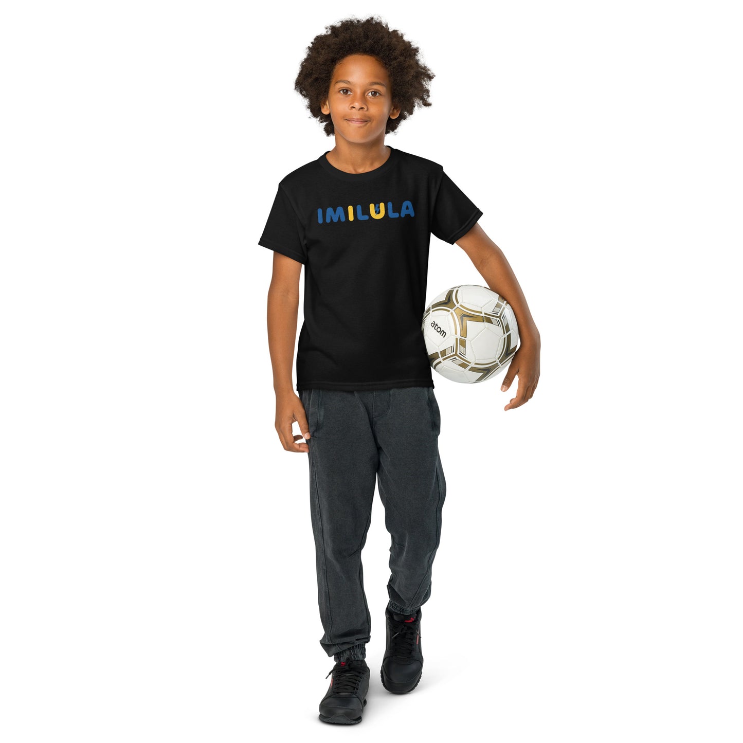 Child holding a soccer ball wearing a black t-shirt with 'ALERT' branding on a white background