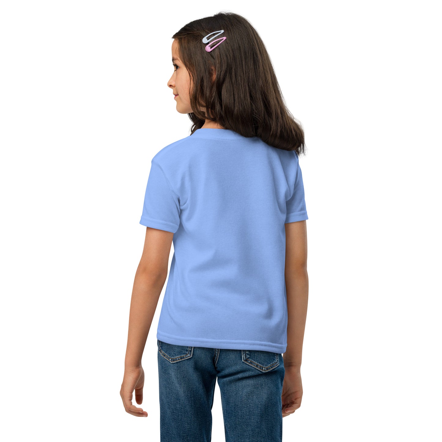 Child wearing a light blue t-shirt and jeans on a white background