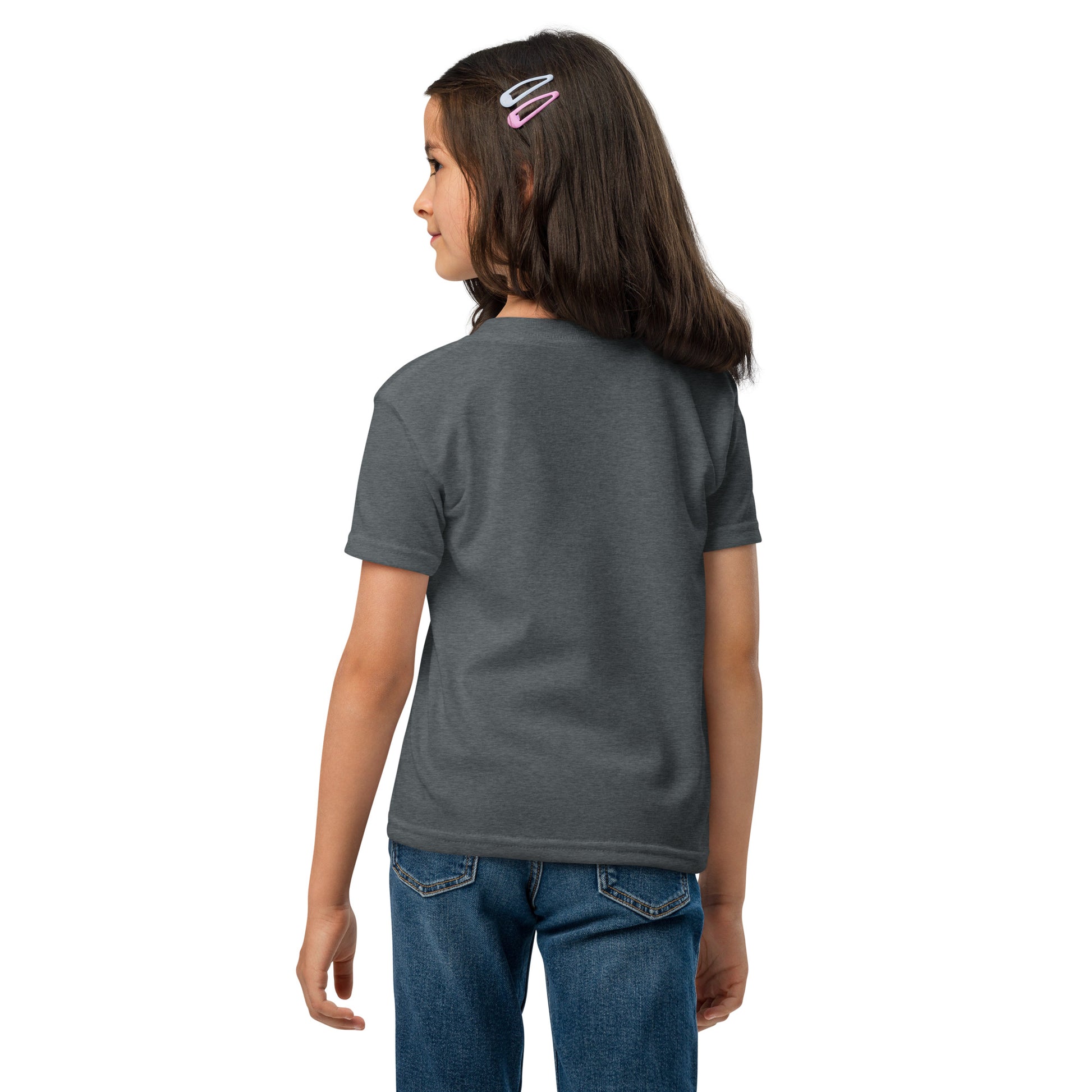 Child wearing a gray t-shirt and blue jeans on a white background