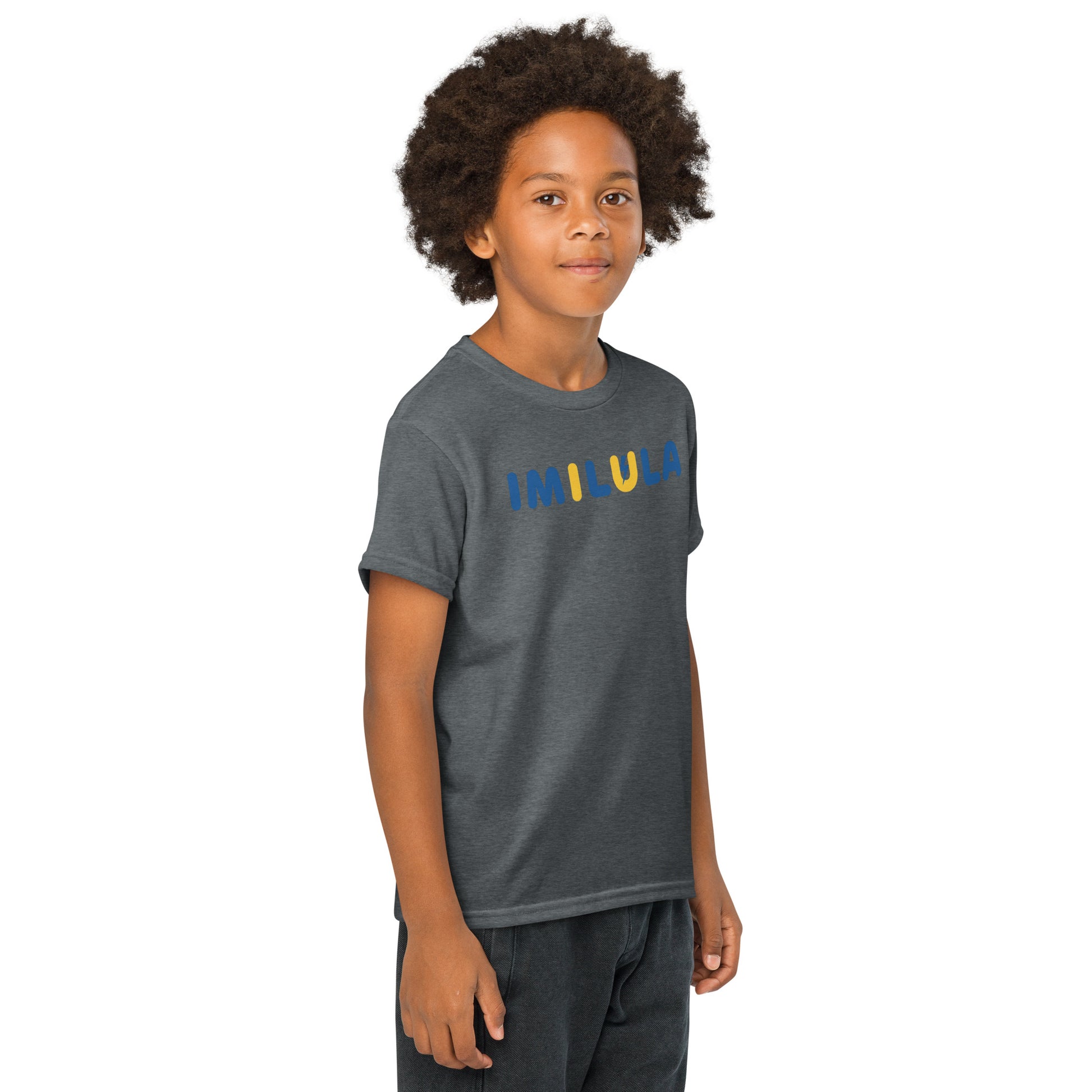 Child wearing a dark gray t-shirt with colorful text on a white background