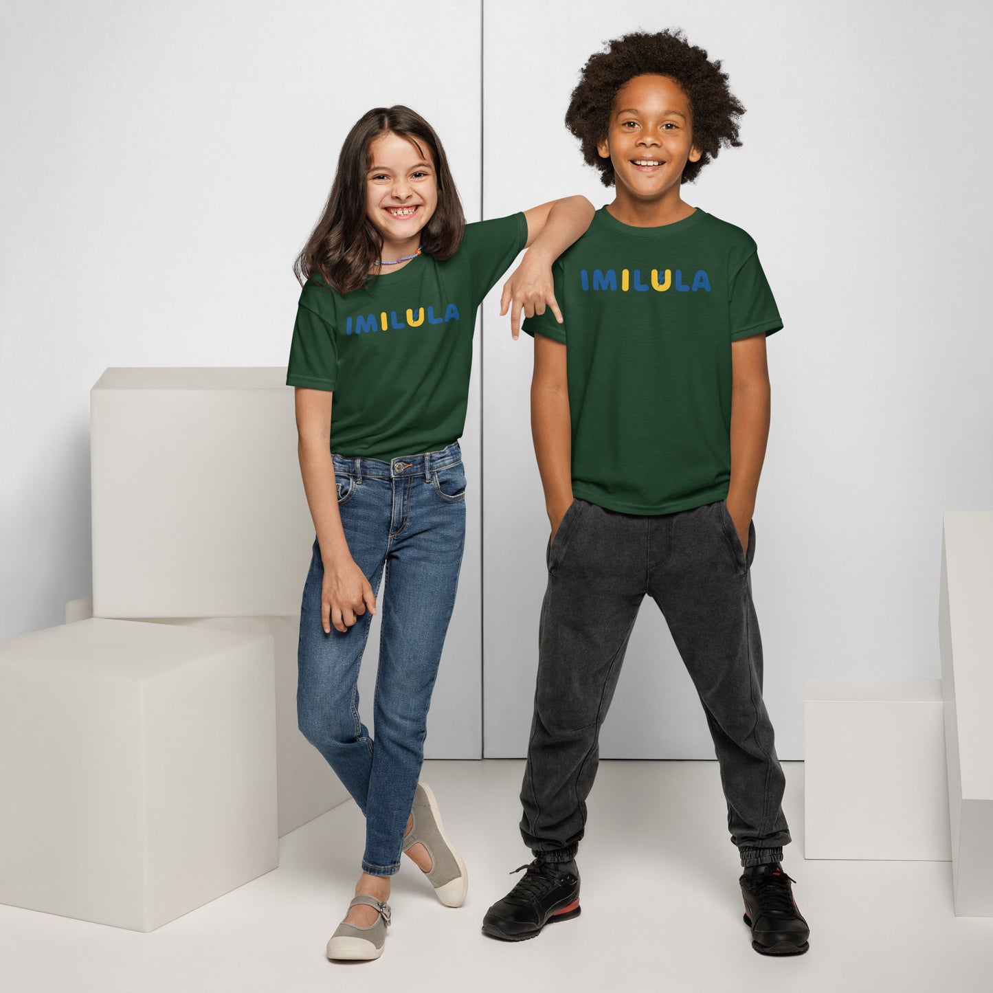Two children wearing green t-shirts with 'Fresh' text, standing in a minimalistic setting.