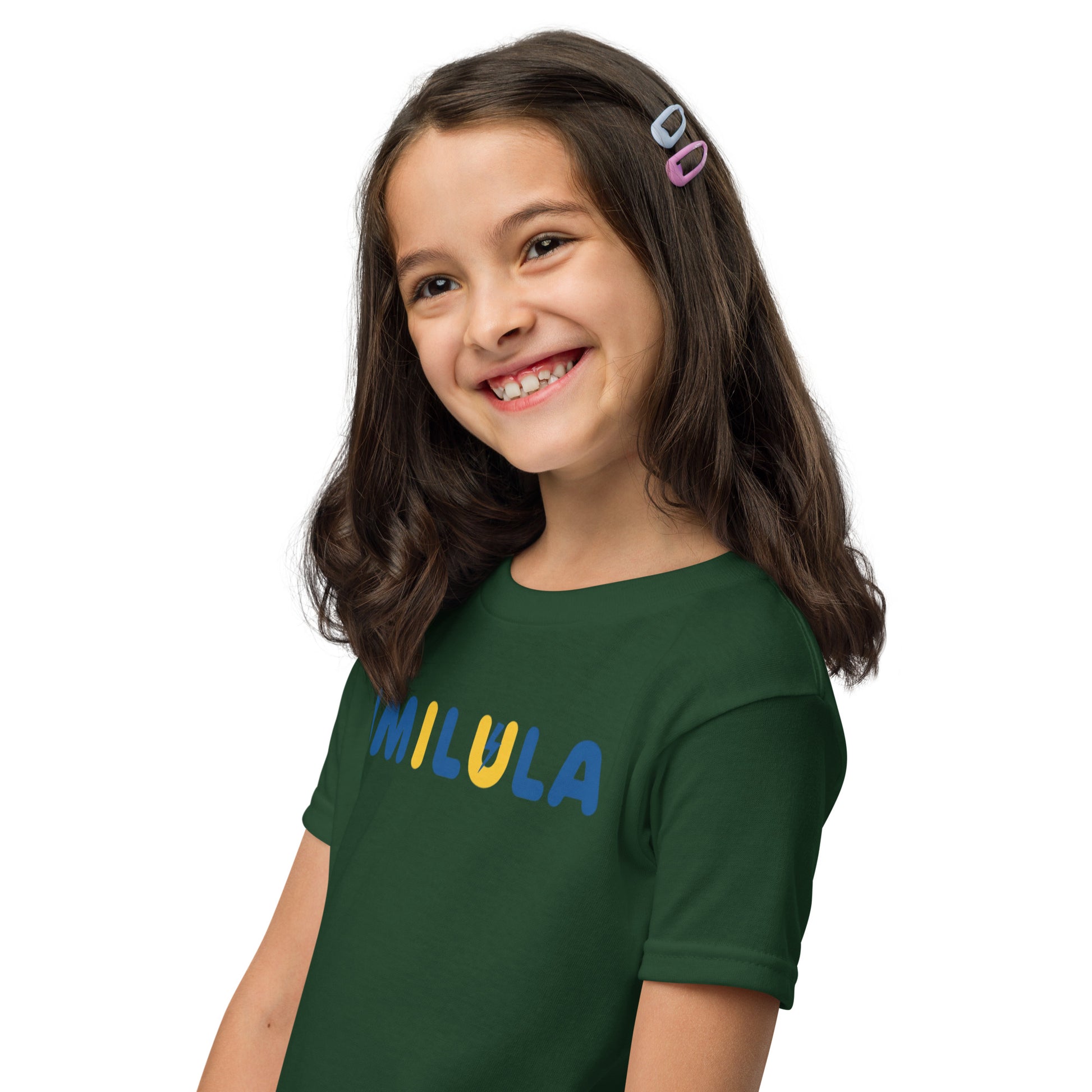 Young girl wearing a green t-shirt with 'Chosen' text on a white background