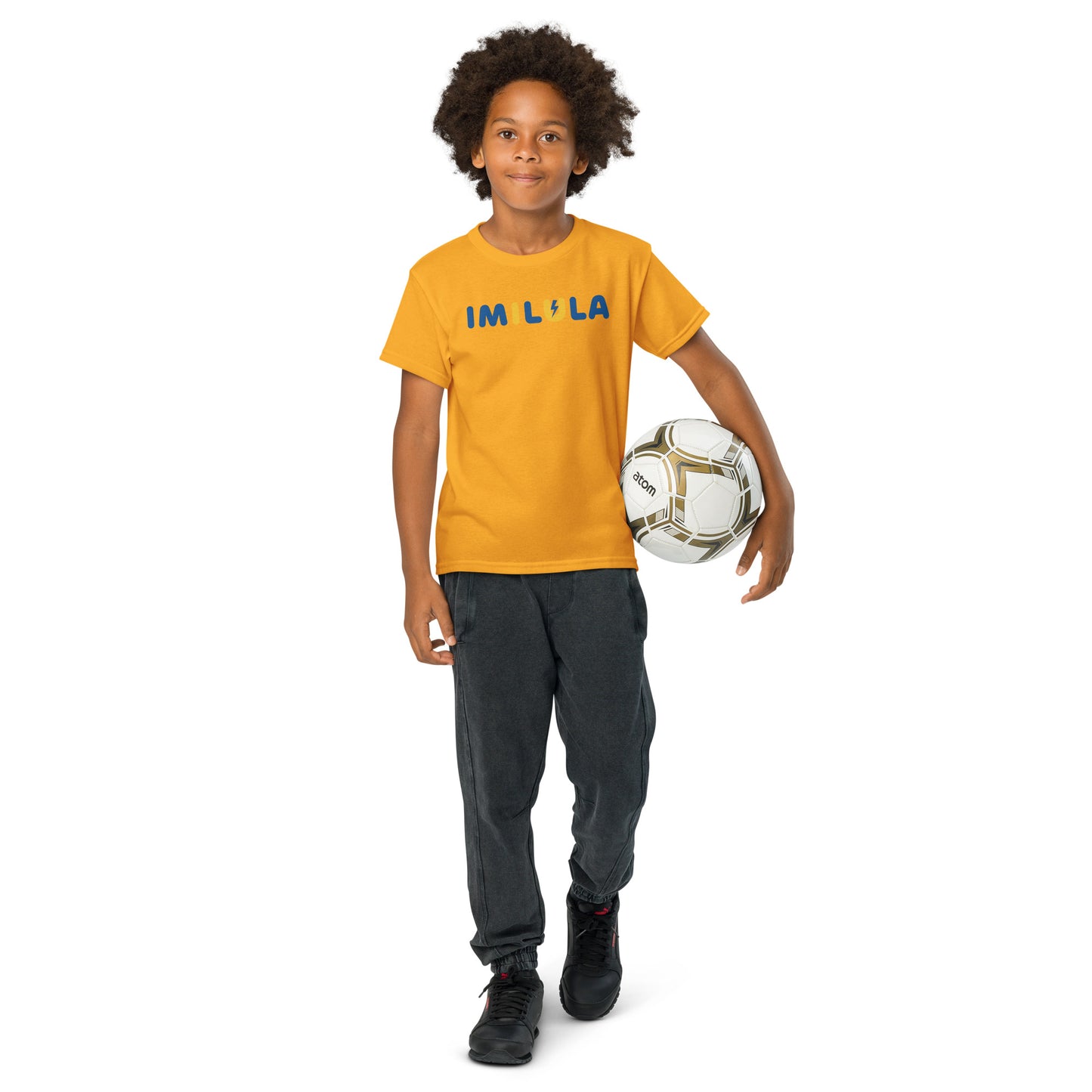 Child wearing a yellow t-shirt with 'Riley Ru' holding a soccer ball on a white background
