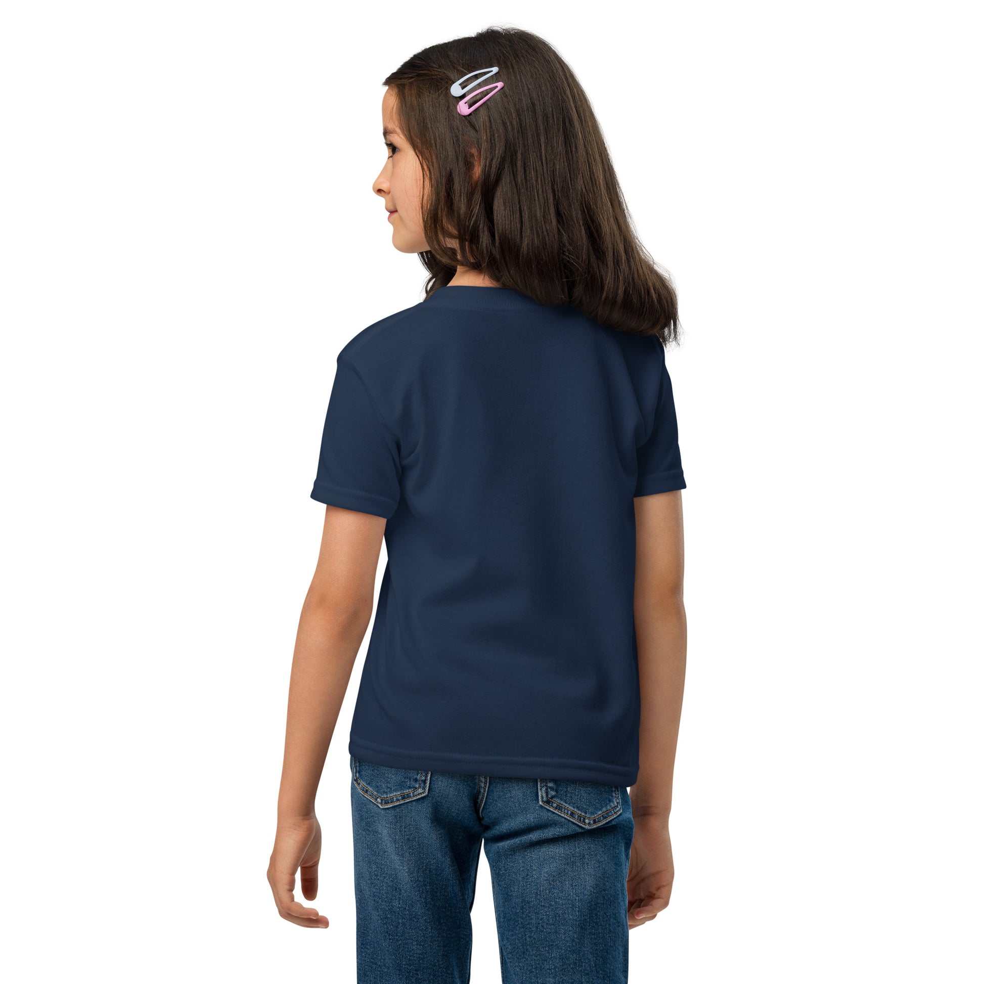 Child wearing a navy blue t-shirt and jeans on a white background