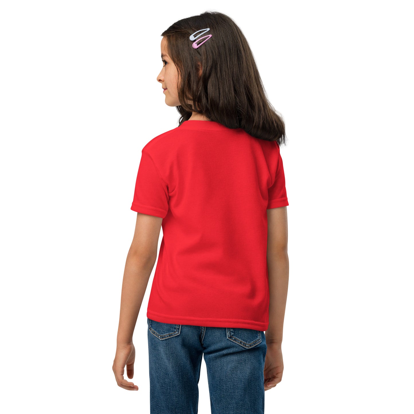 Child wearing a red shirt and blue jeans on a white background